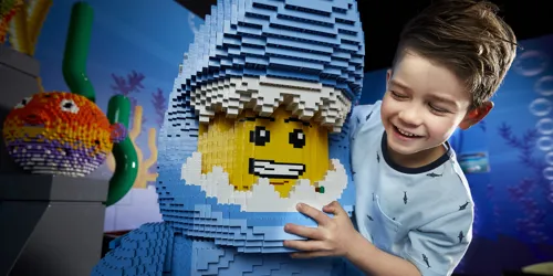 child with lego figure